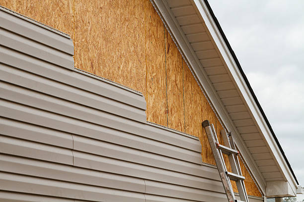 Professional Storm Damage Siding Repair technician working in Roslyn, PA